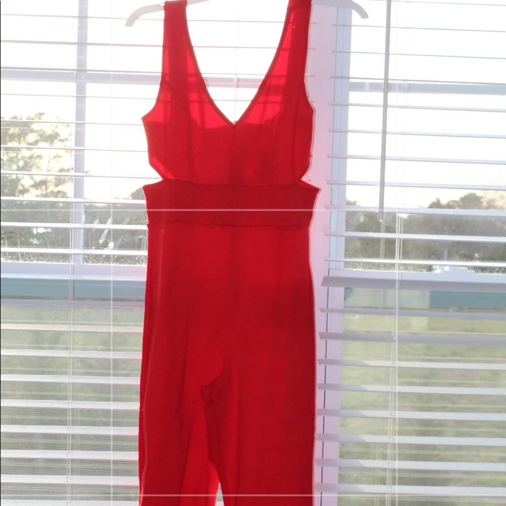 Red tight fitting Jumpsuit with cutouts